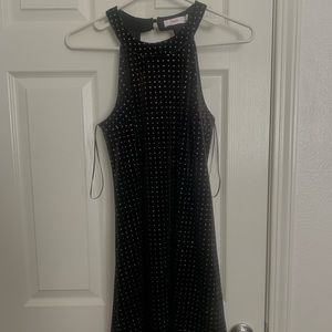I am selling this black dress with gems on it. It goes pass your knees
